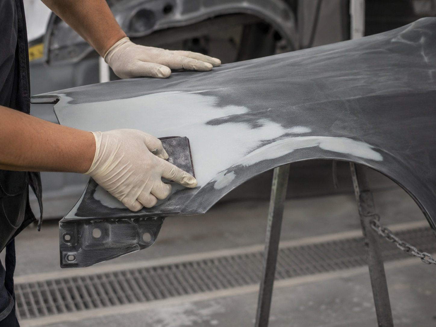 Freshly painted vehicle parts in a paint area